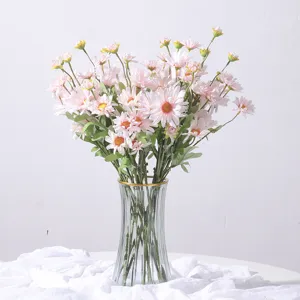 Lush artificial pink daisy flower bouquet in ribbed glass vase for home decoration