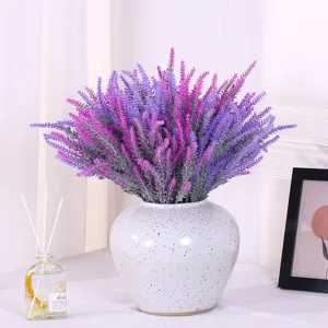 Lush artificial flocked lavender bouquet in white ceramic vase for home decor