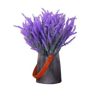 Realistic purple flocked artificial lavender bouquet in a stylish textured glass vase