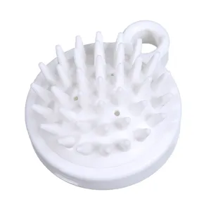 White silicone scalp massage brush with soft spikes and hanging loop for hair washing