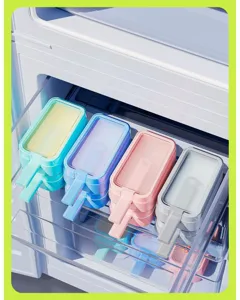 Detailed view of colorful silicone popsicle molds stored in a refrigerator drawer