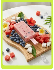 Pink fruit popsicle with blueberries and watermelon made using a silicone ice cream mold