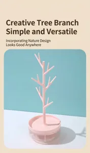 Close-up detail of the pink rotating tree branch jewelry organizer storage rack