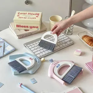 Cute mini broom and dustpan set for desktop and keyboard cleaning in pastel colors