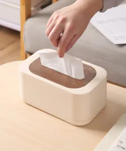 Nordic style cream white tissue box with a wooden lid shown in a cozy home
