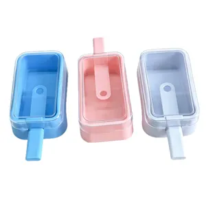 Three colorful homemade popsicle molds with sticks and transparent lids for kids