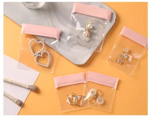 Transparent EVA jewelry storage bags with pink borders for anti-oxidation earring storage