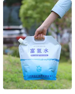 Detailed view of 5L portable foldable water storage bag with handle and spout outdoors.