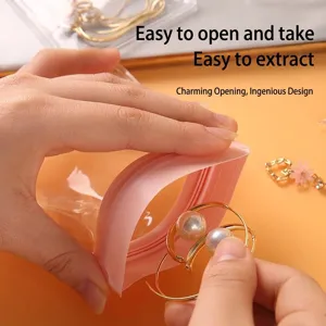 Portable anti-oxidation EVA jewelry storage bag for earrings and necklaces with pink seal