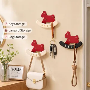 Decorative rocking horse shaped wall hooks for organizing keys and handbags in entryway
