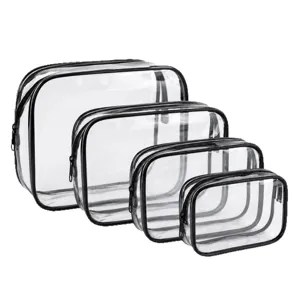 Set di quattro beauty case in PVC trasparente con finiture nere e cerniera in misure