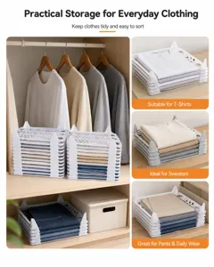 White stackable clothing organizers for wardrobe storage, ideal for T-shirts and sweaters
