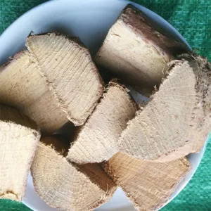 Detailed close-up view of natural dried fruitwood chunks for smoking and BBQ meat grilling.