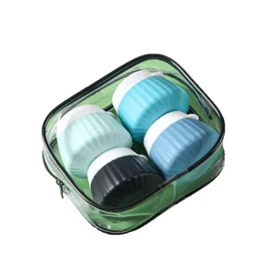 Portable silicone travel bottle set for toiletries in a clear green zipper pouch