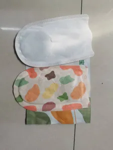 Self-heating foot warmer patches with white surface and abstract colorful pattern