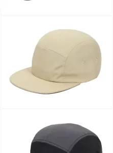Side view detail of a minimalist beige five-panel camper cap with a classic flat brim design