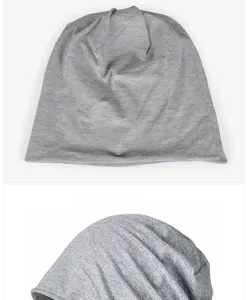 Close-up detail of a soft grey cotton slouchy beanie hat showing its smooth fabric texture