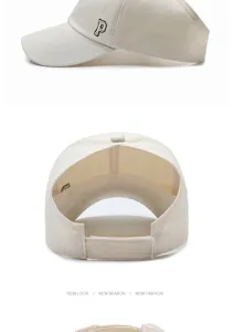 Detail of beige ponytail sun visor hat with embroidered P and open back design.