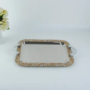 Detail view of rectangular stainless steel tray with crystal-crushed border and handles