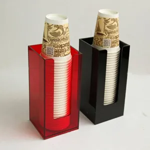 Detail view of acrylic cup holders showing red and black storage organizers