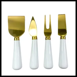 Set de couteaux à fromage en acier inoxydable doré avec manches en céramique blanche