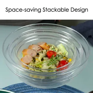 Set of stackable transparent acrylic salad bowls shown with fresh salad and pasta