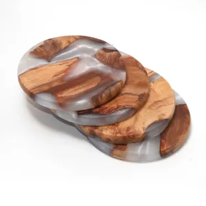 Handcrafted set of four circular coasters made of natural wood and semi-transparent resin