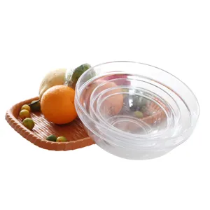 Set of transparent acrylic salad bowls with a brown textured fruit tray accessory