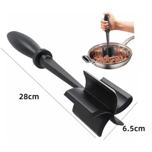 Detailed view of black meat chopper kitchen tool with dimension marks 28cm and 6.5cm.