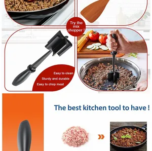Close-up detail of black plastic meat masher tool showing ergonomic handle and chopper blades in pan.