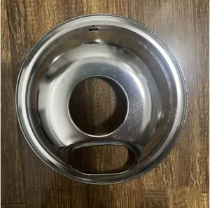 Detailed overhead view of a circular stainless steel gas stove drip pan and oil bowl accessory