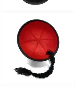 Close-up view of a traditional Chinese melon skin hat showing the red interior and black braid.