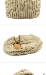 Close-up of ribbed knit texture and warm fleece lining on a khaki beret hat.