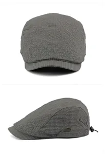 Detailed front and side views of a grey breathable jacquard newsboy cap for summer