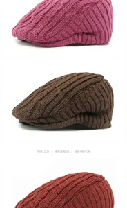 Detail view of retro knitted beret hats in various colors with cable knit pattern