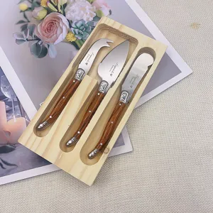 Laguiole 3-piece cheese knife set with wood grain handles and pine storage block.
