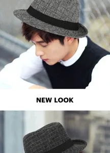 Detail view of a stylish British style men's plaid fedora hat with a black decorative band.