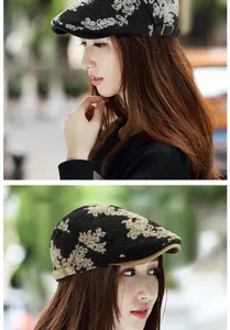 Detailed view of a vintage floral jacquard beret hat on a female model in outdoor light.