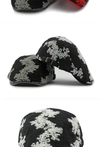 Detail view of black jacquard floral knit beret with adjustable metal buckle closure