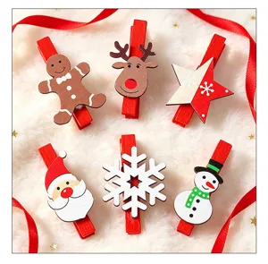 Detail view of assorted Christmas wooden clips including Santa and Reindeer designs