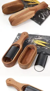 Detailed view of black stainless steel cheese grater with natural acacia wood container base.