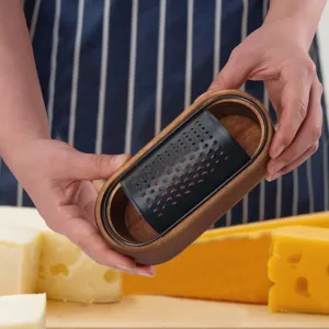 Handheld acacia wood and black stainless steel cheese grater with wooden storage box