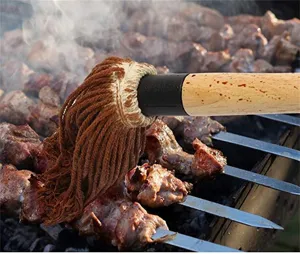 Pure cotton BBQ mop brush with long wooden handle for basting meat on a grill