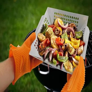 Stainless steel square grill basket with holes, outdoor BBQ tool for vegetables, detail view.