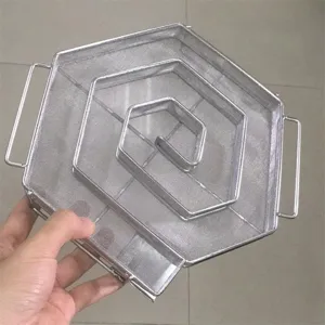 Detailed view of the hexagonal stainless steel mesh cold smoke generator for BBQ smoking
