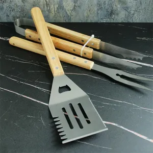 Detailed view of heavy duty stainless steel BBQ tool set with premium oak wood handles