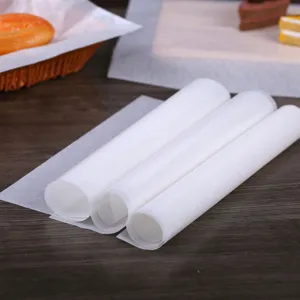 Detail showing three rolls of white translucent greaseproof food wrapping paper.