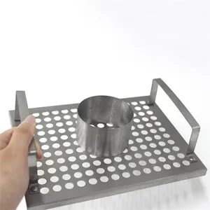 Stainless steel dancing chicken roaster rack detail showing perforated tray and handle