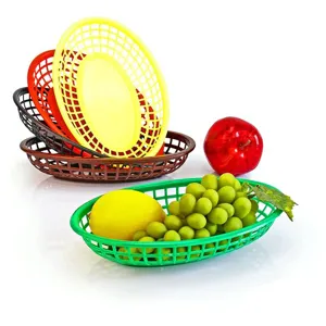 Set of colorful plastic fast food baskets displaying fruits for restaurant and home use