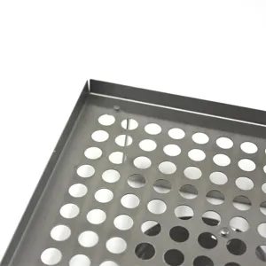 Close-up detail view of the durable stainless steel perforated BBQ chicken roasting tray surface